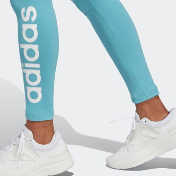 ADIDAS SPORTSWEAR Skinny Urheiluhousut 'Essentials' värissä sininen