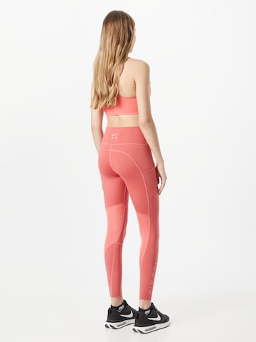 NIKE Skinny Sportbroek in Oranje