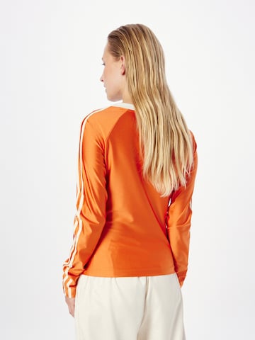 oranžinė ADIDAS ORIGINALS Marškinėliai 'Adicolor 70S'