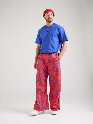 Loosefit Pantalon Nike Sportswear en rouge