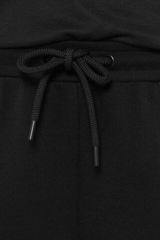 SENSES.THE LABEL Regular Weite Hose aus Interlock-Jersey in Schwarz