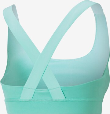 PUMA Bustier Biustonosz sportowy w kolorze zielony