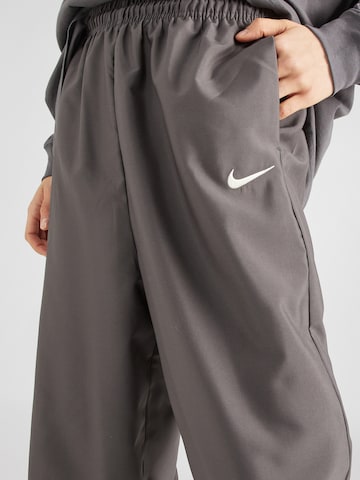 pilka Nike Sportswear Siaurėjantis Kelnės 'TREND'