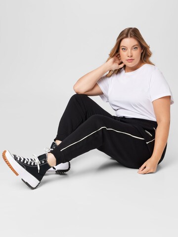 Effilé Pantalon de sport 'Piping' Reebok en noir