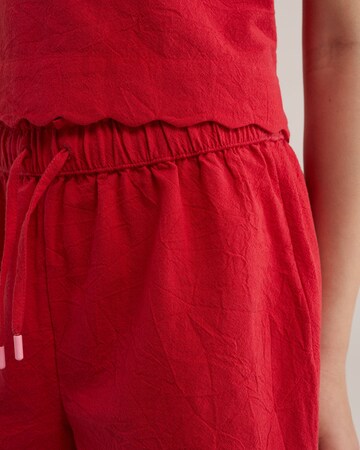 Largi Pantaloni de la WE Fashion pe roșu