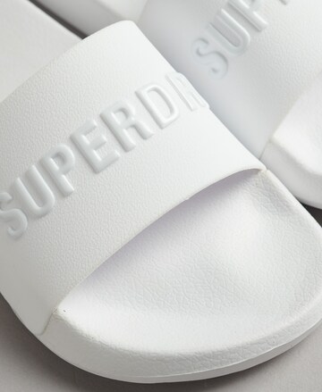 Claquettes / Tongs Superdry en blanc