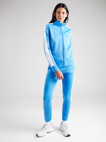 UNDER ARMOUR Skinny Tepláková souprava – modrá: přední strana