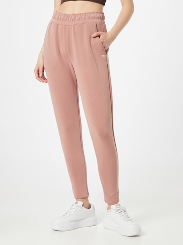 Athlecia Tapered Workout Pants in Pink: front