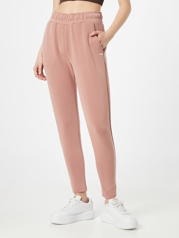 Tapered Pantaloni sportivi di Athlecia in rosa: frontale