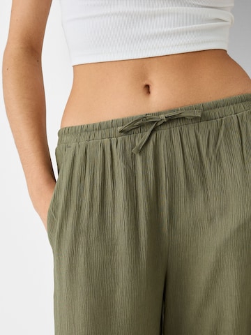 Bershka Zvonové kalhoty Kalhoty – zelená