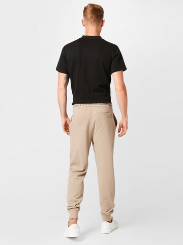 Tapered Pantaloni di Calvin Klein Jeans in beige