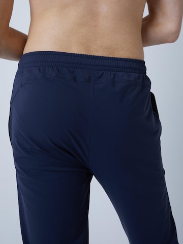 SPORTKIND - Slimfit Pantalón deportivo 'Slim Training Pants' en azul