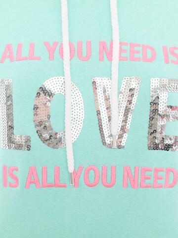 Zwillingsherz Sweatshirt 'Love is all you need' in Grün