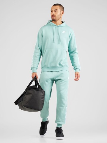 Nike Sportswear Joggingpak 'CLUB FLEECE' in Blauw