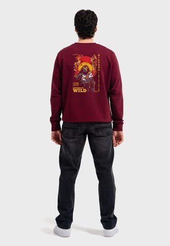 Oldskull Sweatshirt 'Wrldvibe Return to Wild Graphic' in Rood