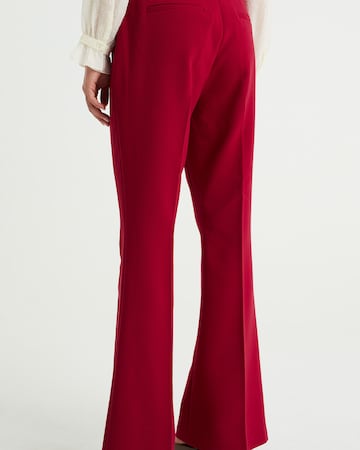 WE Fashion Flared Trousers with creases in Red
