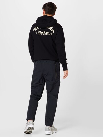 Nike Sportswear Tapered Housut värissä musta