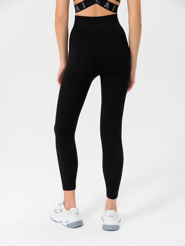 MOROTAI Skinny Sportbroek 'Naikan' in Zwart