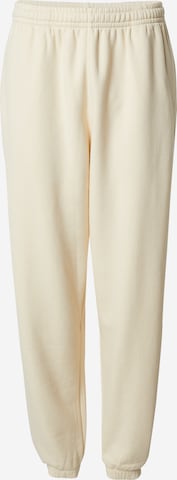 smėlio Nike Sportswear Standartinis Kelnės 'CLASSICS': priekis