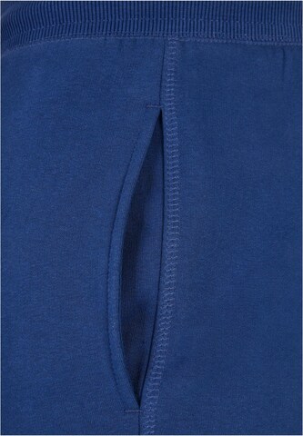 Tapered Pantaloni di Urban Classics in blu