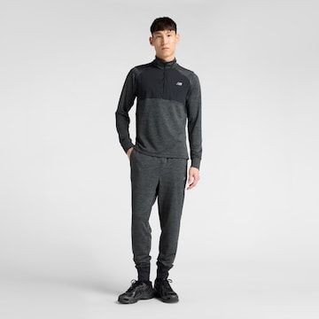 Effilé Pantalon de sport 'Athletics Heat Grid' new balance en noir