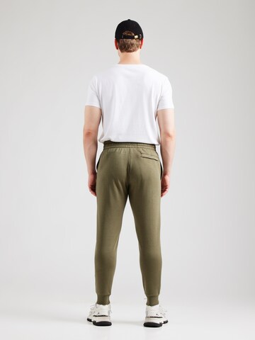 UNDER ARMOUR Tapered Sporthose in Grün