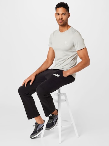 PUMA - regular Pantalón deportivo 'Essentials' en negro