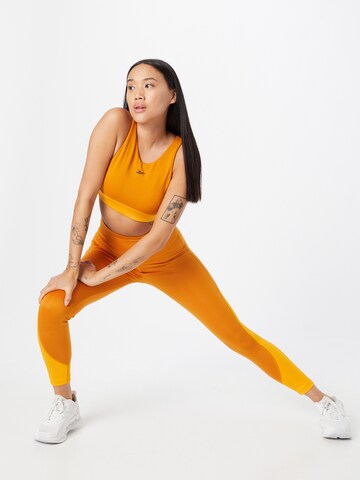 Reebok Skinny Workout Pants in Orange