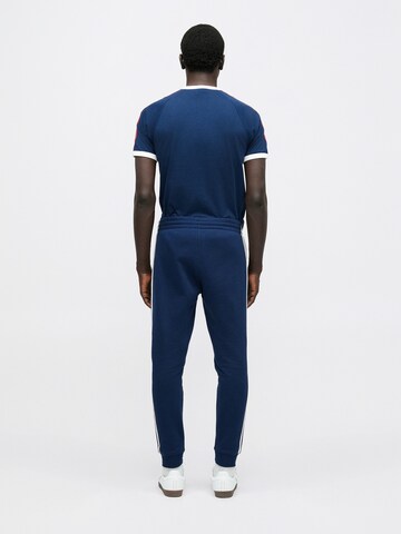 Effilé Pantalon ADIDAS ORIGINALS en bleu