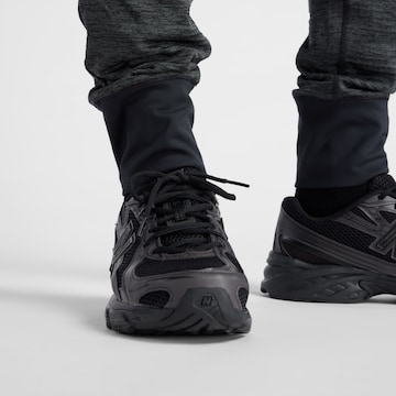 Effilé Pantalon de sport 'Athletics Heat Grid' new balance en noir
