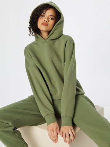 ABOUT YOU x INNA Sweatshirt 'Alessia' in Green: front