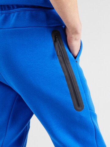 Nike Sportswear Tapered Παντελόνι 'TCH FLC' σε μπλε