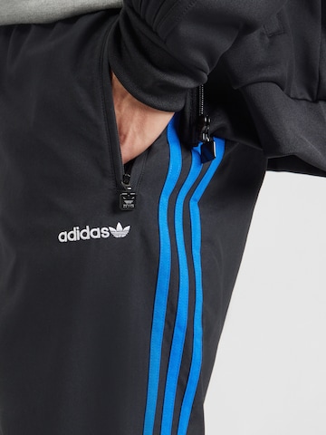Tapered Pantaloni 'BRUSHED' di ADIDAS ORIGINALS in nero