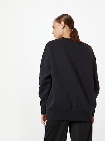 UNDER ARMOUR Sportief sweatshirt 'Essential' in Zwart