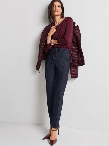MADELEINE Slim fit Trousers in Red