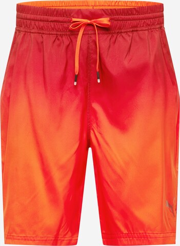 PUMA Regular Workout Pants in Orange: front