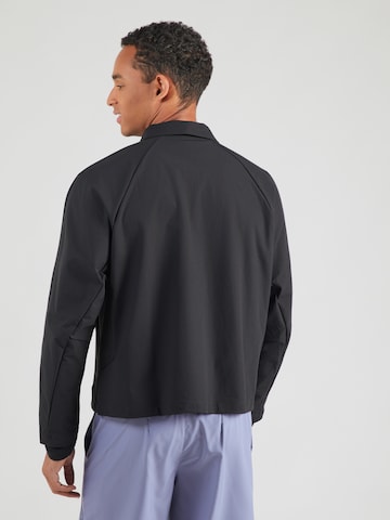 NIKE Urheilutakki värissä musta: takapuoli