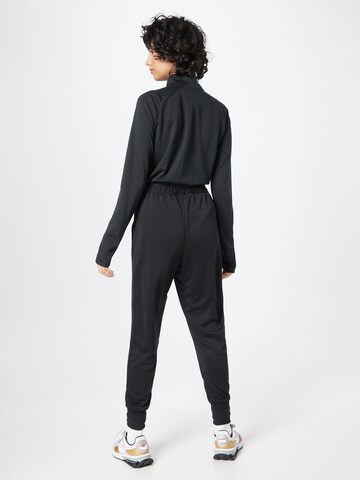 Effilé Pantalon de sport NIKE en noir