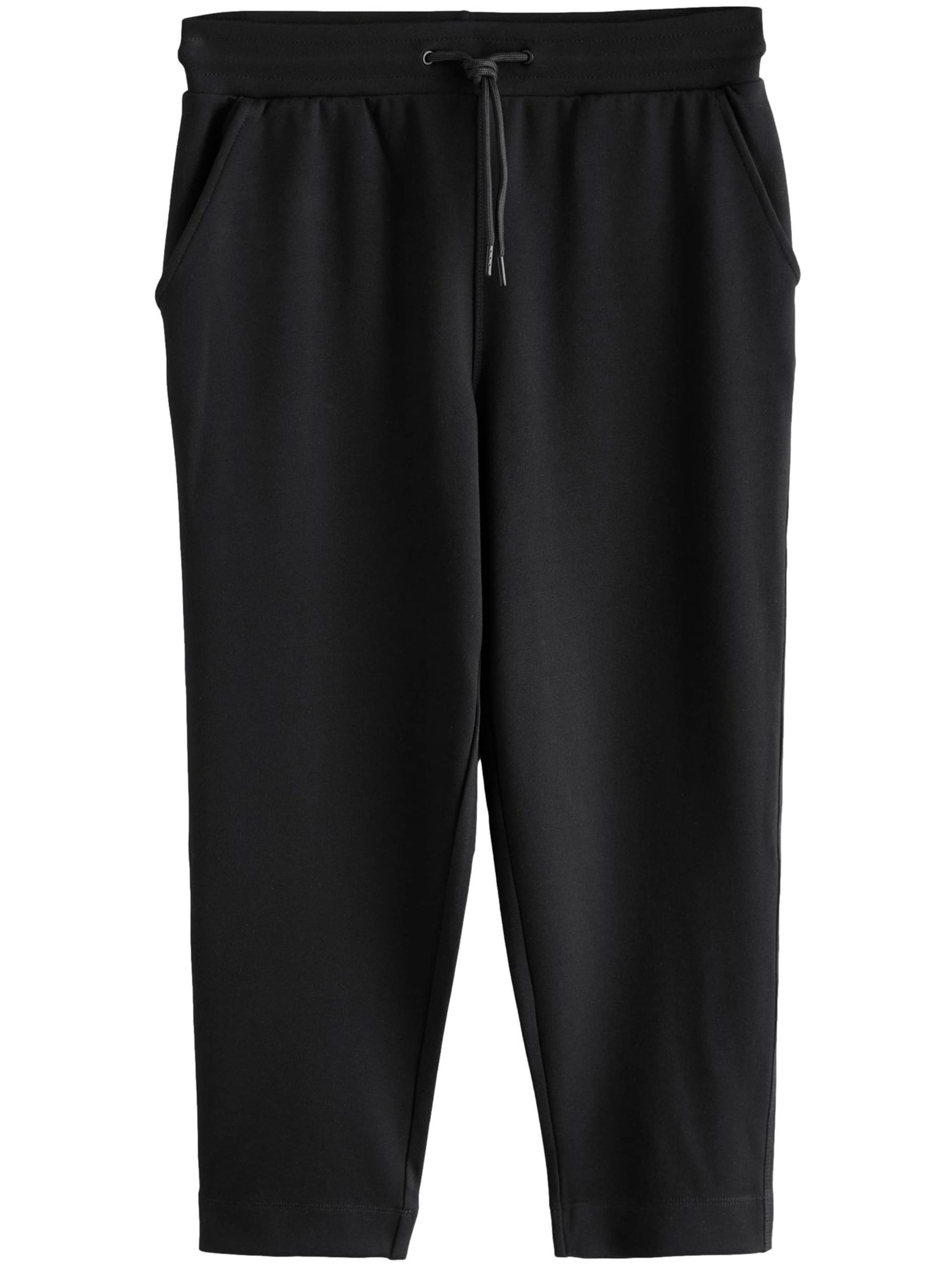 Next Alt kitsenev Püksid, värv must: eest vaates