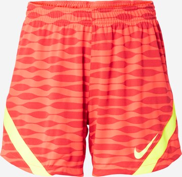 NIKE Workout Pants in Orange: front