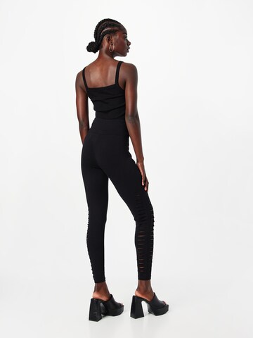 ABOUT YOU - Skinny Calças 'Elisa' em preto