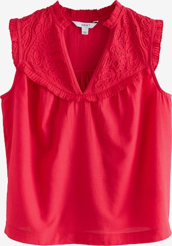 Next Pusero värissä punainen: etupuoli