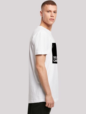 T-Shirt 'SELF CARE' F4NT4STIC en blanc