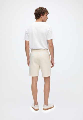 Regular Pantaloni de la Karl Kani pe bej