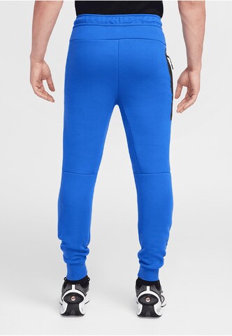 NIKE Tapered Broek in Blauw