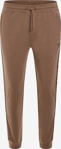 GUESS Tapered Pants in Brown: front