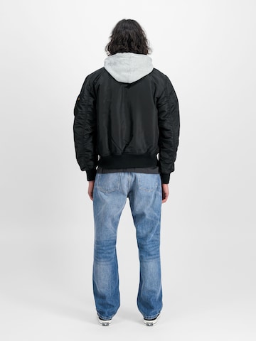 ALPHA INDUSTRIES Välikausitakki 'MA-1 D-Tec' värissä musta