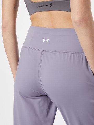 Effilé Pantalon de sport 'Meridian' UNDER ARMOUR en violet
