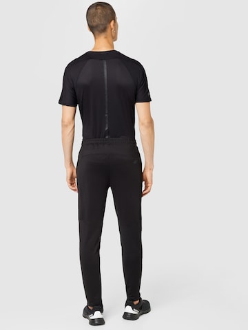 Tapered Pantaloni sportivi di 4F in nero