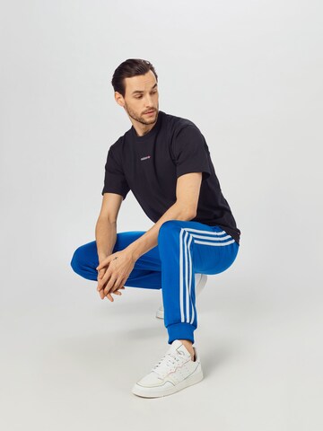 ADIDAS ORIGINALS T-Shirt 'Linear' in Schwarz